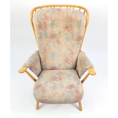 2140 - Ercol light elm Evergreen stick back armchair, with floral button back upholstery, 102cm high