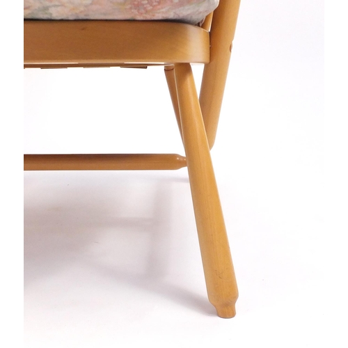 2140 - Ercol light elm Evergreen stick back armchair, with floral button back upholstery, 102cm high