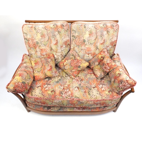 2075 - Ercol Renaissance two seater settee, with floral upholstered lift off cushions, approximately 140cm ... 