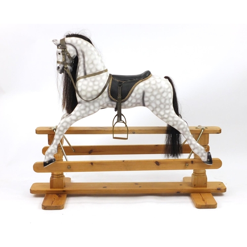 2064 - Hand painted carved wood rocking horse, on a pine base, with horse hair mane and tail, 107cm hair x ... 