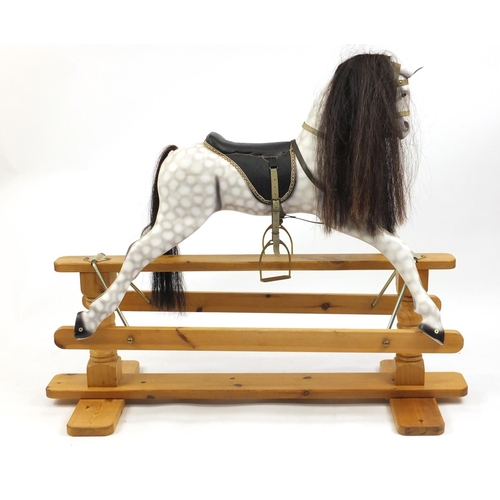 2064 - Hand painted carved wood rocking horse, on a pine base, with horse hair mane and tail, 107cm hair x ... 