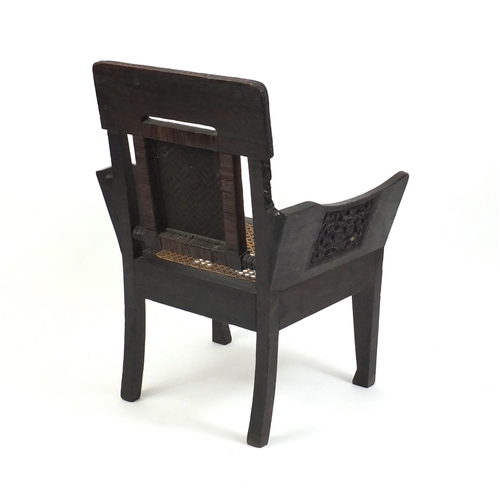 2107 - Antique Anglo Indian carved hardwood occasional chair, with cane back and seat, 91.5cm high