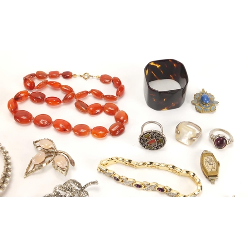 2827 - Costume jewellery including a carnelian necklace, brooches, silver rings and a rectangular silver ci... 