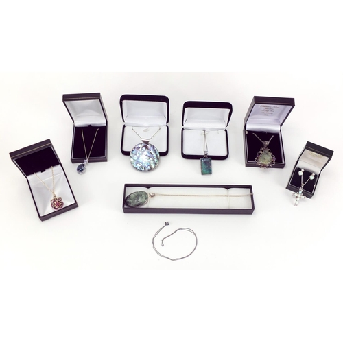 2824 - Six silver and semi precious stone pendants on necklaces and a opal and clear stone cross with match... 