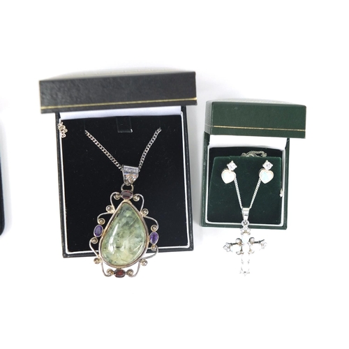 2824 - Six silver and semi precious stone pendants on necklaces and a opal and clear stone cross with match... 