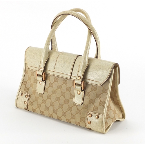 2246 - Gucci cream leather and monogrammed bag, 29cm wide