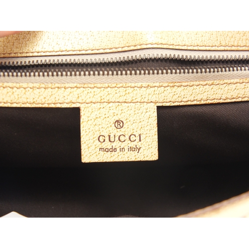 2246 - Gucci cream leather and monogrammed bag, 29cm wide