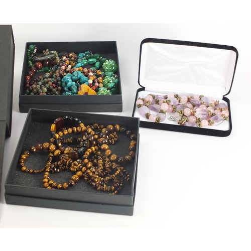 2831 - Large collection of carved semi precious stone jewellery including tiger's eye, malachite, amethyst,... 
