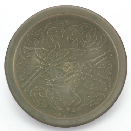 2197 - Chinese green glazed pottery bowl, pierced and decorated in low relief with phoenixes amongst clouds... 