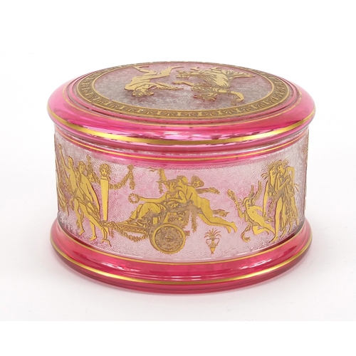 2222 - Cranberry glass pot and cover in the style of Moser, etched and gilded with classical figures, 7.5cm... 