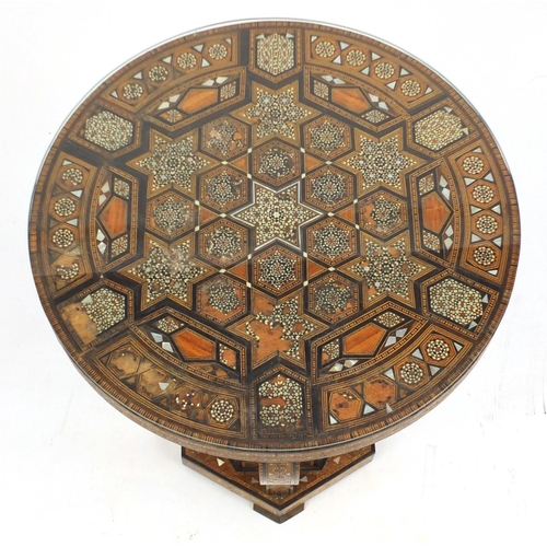 2072 - Moorish design circular topped occasional table, with hexagonal stepped base, having a geometric par... 