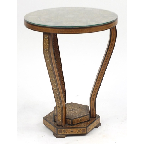 2072 - Moorish design circular topped occasional table, with hexagonal stepped base, having a geometric par... 