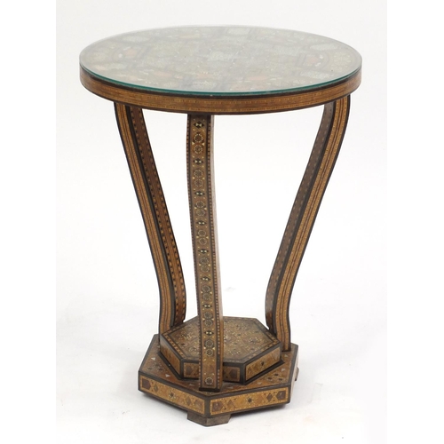 2072 - Moorish design circular topped occasional table, with hexagonal stepped base, having a geometric par... 