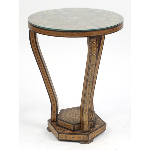 2072 - Moorish design circular topped occasional table, with hexagonal stepped base, having a geometric par... 