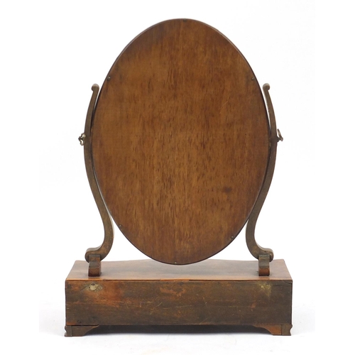 2131 - Georgian oval toilet mirror, the serpentine fronted base with three drawers, 60cm high