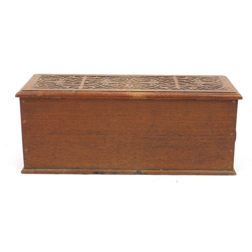 2127 - Rectangular oak chest with ring turned handles, carved with flower heads and stylised foliage, 26cm ... 