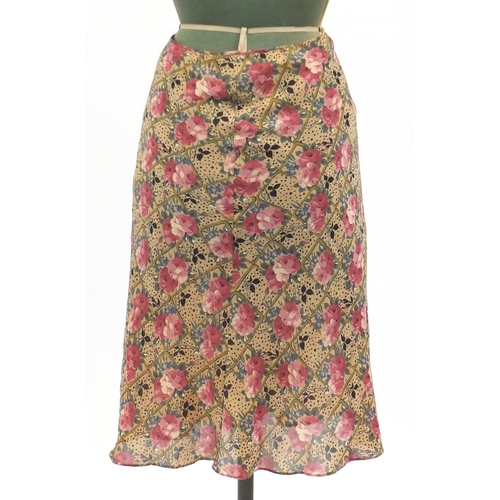 2252 - Chanel cashmere cardigan and two skirts comprising Chanel and Christian Dior, The Dior skirt size 8