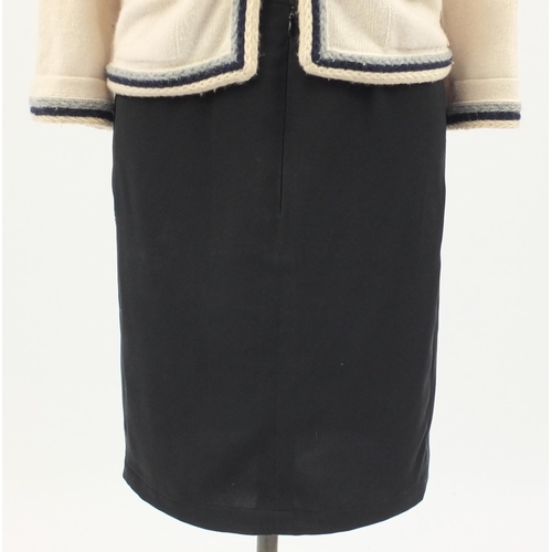 2252 - Chanel cashmere cardigan and two skirts comprising Chanel and Christian Dior, The Dior skirt size 8