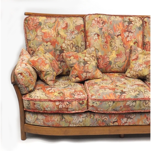 2074 - Ercol Renaissance three seater settee, with floral upholstered lift off cushions, approximately 190c... 