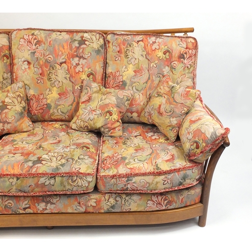 2074 - Ercol Renaissance three seater settee, with floral upholstered lift off cushions, approximately 190c... 