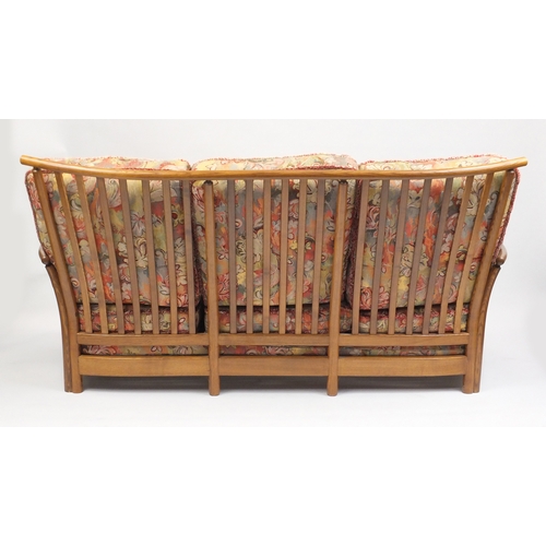 2074 - Ercol Renaissance three seater settee, with floral upholstered lift off cushions, approximately 190c... 