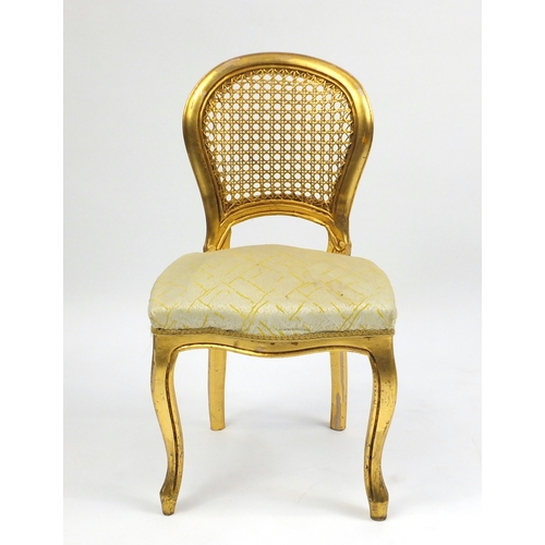 2136 - Pair of French gilt occasional chairs, with cane backs and stuff over seats, 82cm high