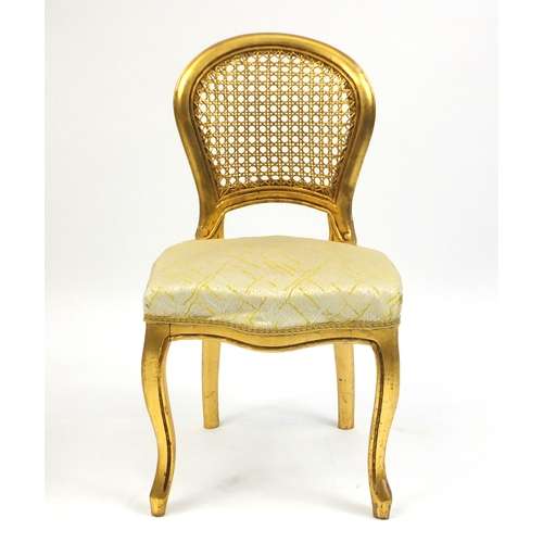 2136 - Pair of French gilt occasional chairs, with cane backs and stuff over seats, 82cm high