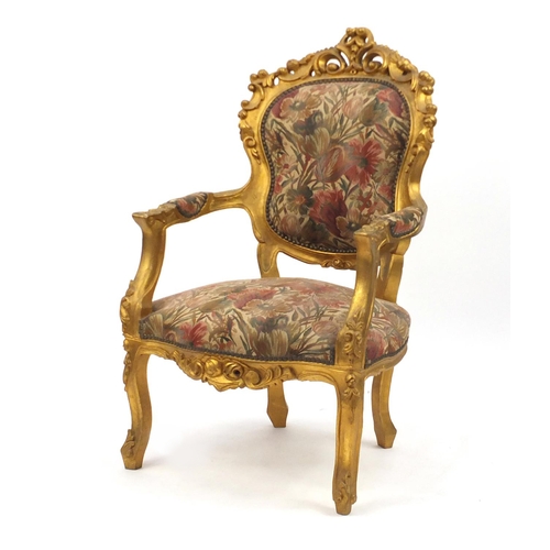 2049 - Ornate French gilt wood open armchair with floral upholstery, carved with rosettes and scrolls, 110c... 