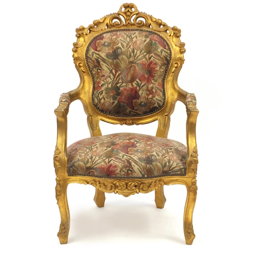 2049 - Ornate French gilt wood open armchair with floral upholstery, carved with rosettes and scrolls, 110c... 