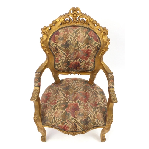 2049 - Ornate French gilt wood open armchair with floral upholstery, carved with rosettes and scrolls, 110c... 