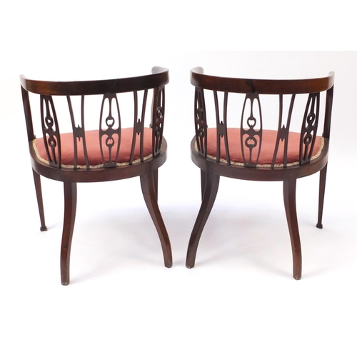 2132 - Pair of inlaid mahogany tub chairs, with pink upholstered stuff over seats, 73cm high