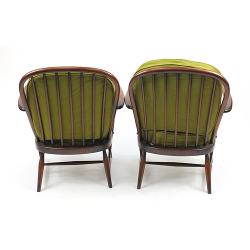 29 - Pair of Ercol elm stickback open armchairs, with green upholstery, 77cm high
