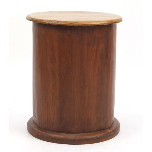 57 - Cylindrical Mexican pine three drawer pedestal chest, 56cm high x 46cm in diameter