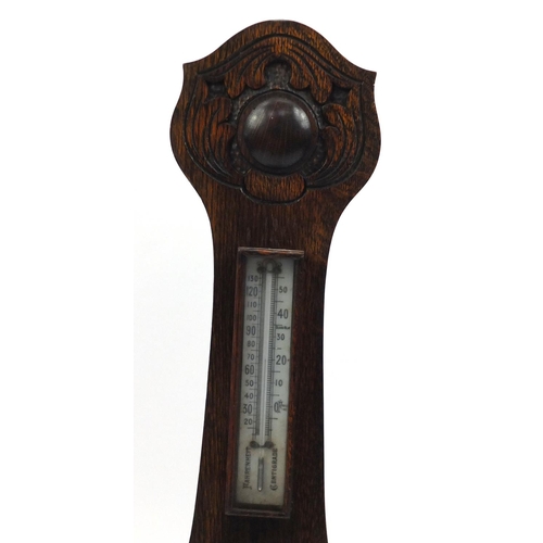 2162 - Wall hanging carved oak aneroid barometer and thermometer, 80cm high