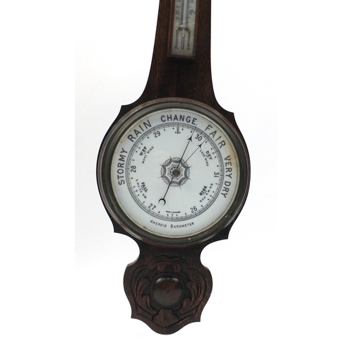 2162 - Wall hanging carved oak aneroid barometer and thermometer, 80cm high