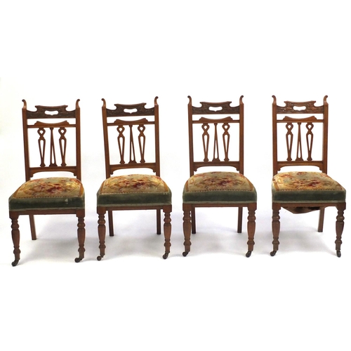 24 - Set of four carved walnut dining chairs with green stuff over seats, 100cm high