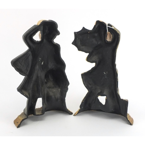 2255 - Pair of hand painted cast iron Laurel and Hardy design door stops, the largest 29cm high
