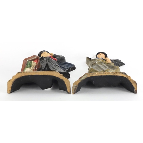 2255 - Pair of hand painted cast iron Laurel and Hardy design door stops, the largest 29cm high