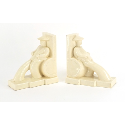 2189 - Pair of Art Deco strongman pottery bookends, each 17.5cm high