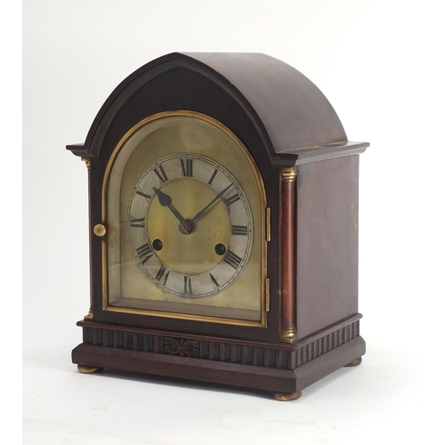 2256 - Mahogany chiming mantel clock with architectural columns, silvered chapter ring and Roman numerals, ... 