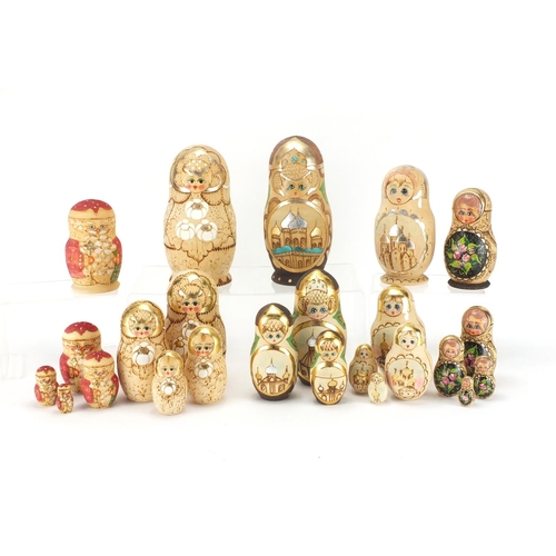 2274 - Five Russian hand painted and pokerwork Matryoshka stacking dolls including a Father Christmas desig... 