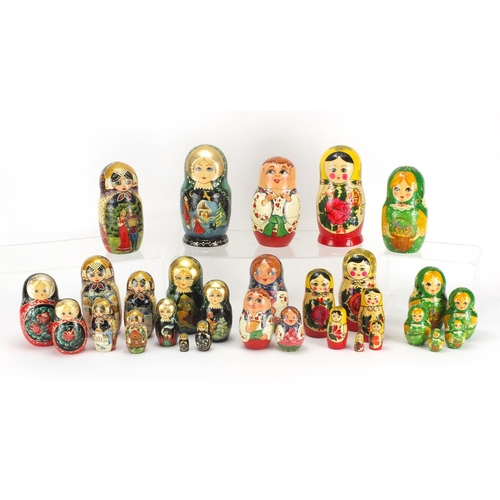2059 - Six hand painted Russian Matryoshka stacking dolls, one inscribed to the base, the largest 16cm high