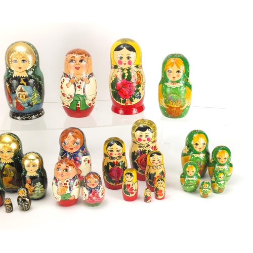 2059 - Six hand painted Russian Matryoshka stacking dolls, one inscribed to the base, the largest 16cm high
