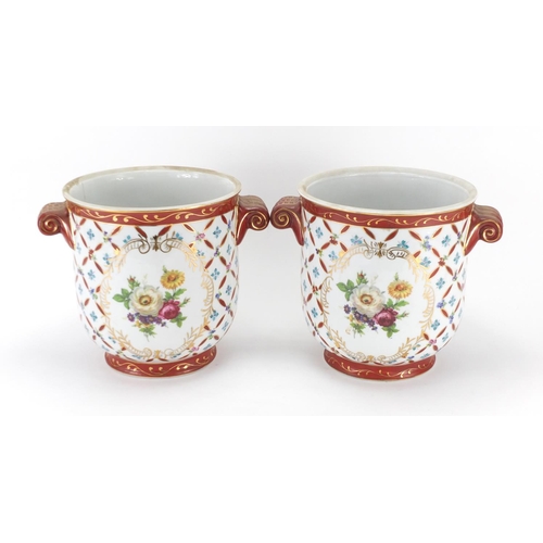 2072 - Pair of continental porcelain planters with twin handles, decorated with flowers, each 20.5cm high