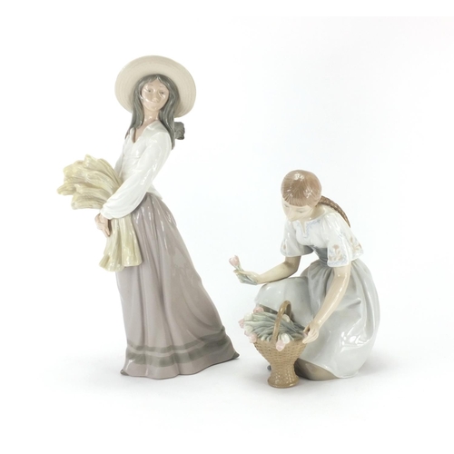 2076 - Two figurines comprising a Lladro girl with flowers and Nao girl holding wheat, the largest 39cm hig... 