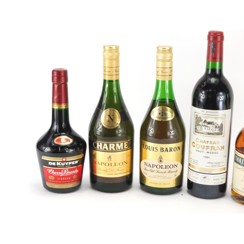 2123 - Six bottles of brandy and Medoc red wine including Louis Baron, Three Barrels and Charme