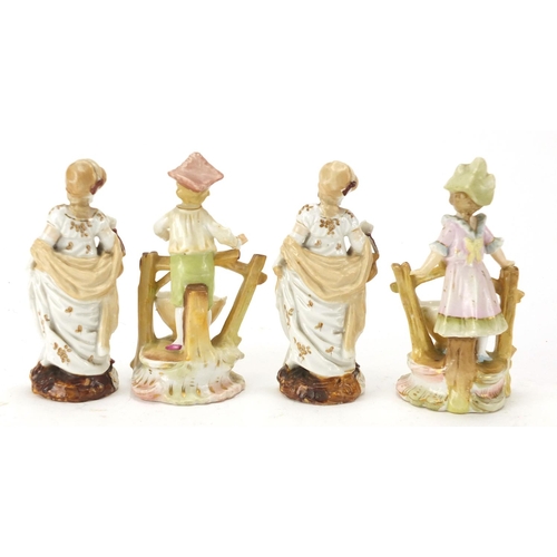 153 - Two pairs of continental porcelain  figures, the largest 11cm high