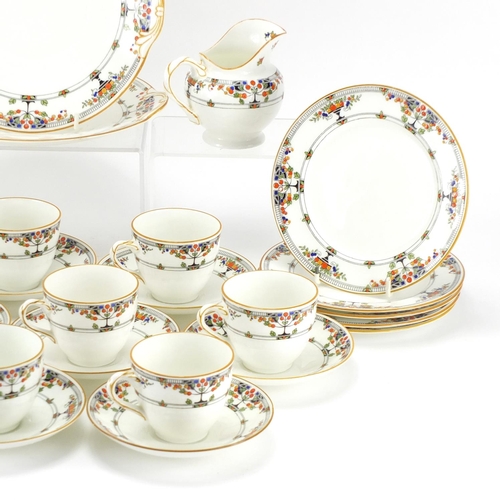 2312 - Royal Doulton teaware enamelled with flowers including ten trio's
