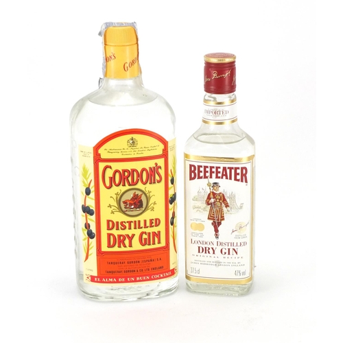 2164 - Bottles of Gordon's distilled gin and a 37.5cl bottle of Beefeater gin