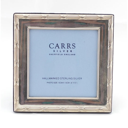 2466 - Square silver easel photo frame with stylised border, by Carrs, 17.5cm x 17.5cm